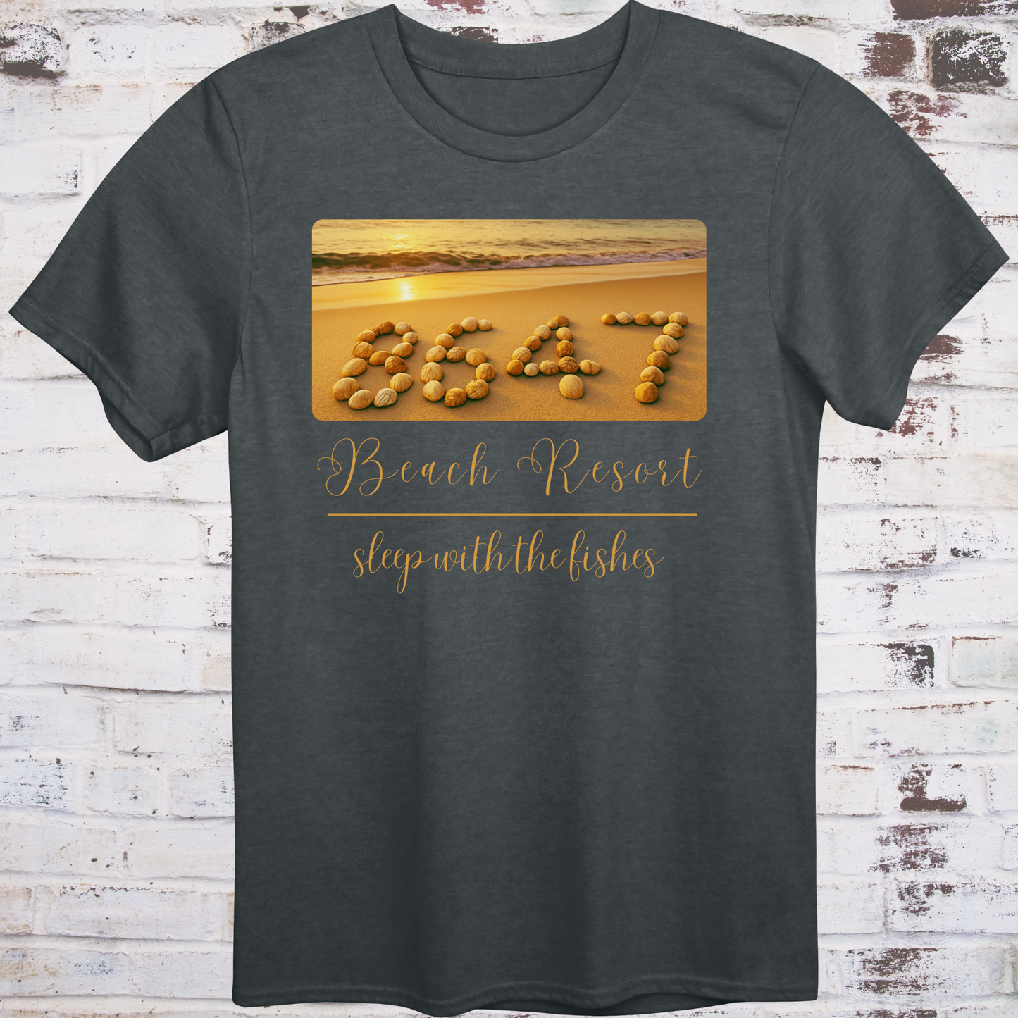Gray t-shirt featuring beach photo with “8647” spelled in seashells
and elegant text reading “Beach Resort – Sleep With the Fishes” –
anti-Trump parody shirt by Democratee’s