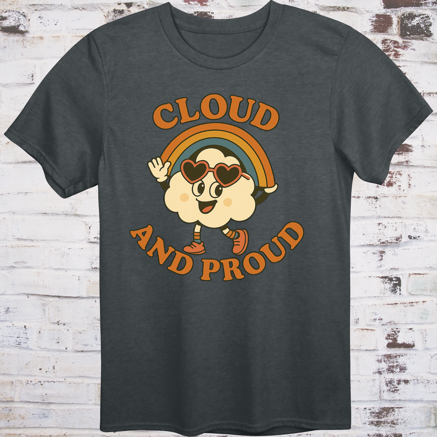 Gray t-shirt with cartoon cloud wearing heart sunglasses
under a rainbow arch, with bold orange text reading "Cloud and Proud" –
retro queer pride shirt by Democratee’s
