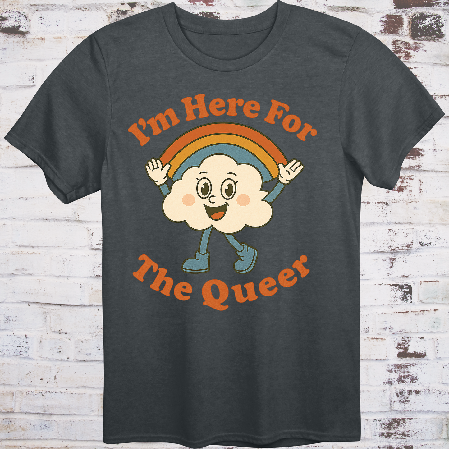 Gray t-shirt with retro-style cartoon cloud wearing boots and a rainbow,
surrounded by bold text reading "I’m Here for the Queer" –
inclusive pride shirt by Democratee’s