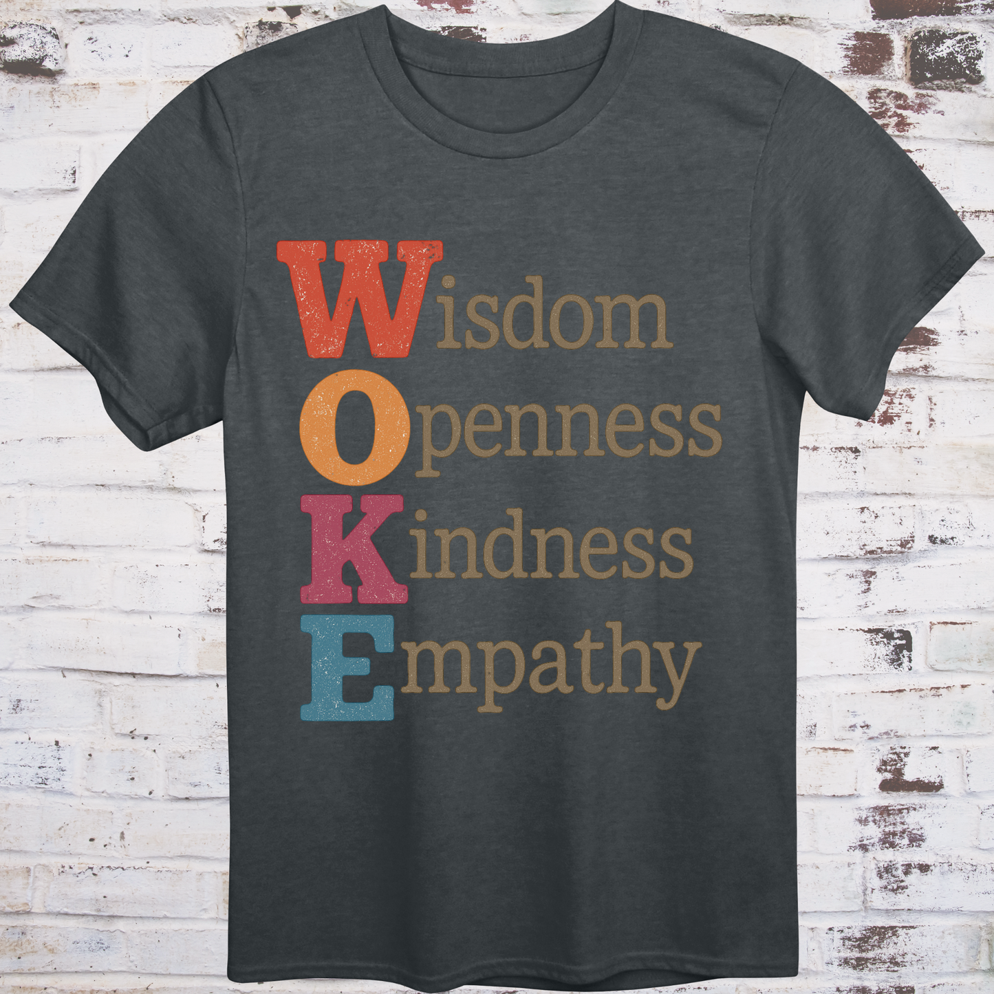 Gray t-shirt with bold vertical WOKE acronym in colorful letters,
spelling out Wisdom, Openness, Kindness, and Empathy –
reclaimed progressive shirt by Democratee’s