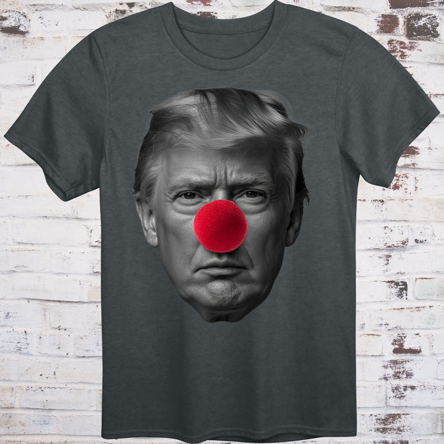 Gray t-shirt featuring a high-contrast black-and-white photo
of Donald Trump’s face with a large red clown nose –
minimalist parody protest shirt by Democratee’s