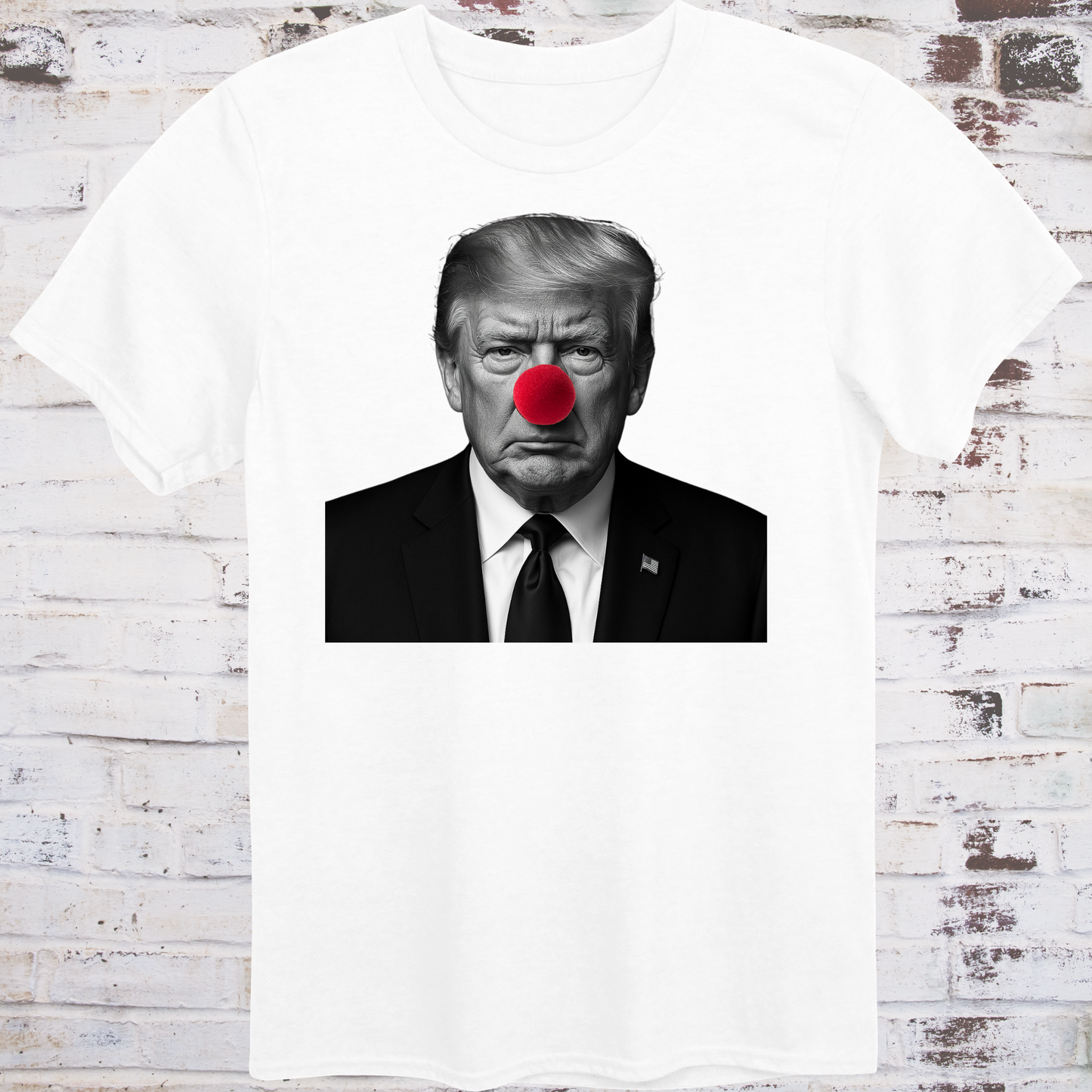 White t-shirt with black-and-white photo of Donald Trump wearing a red clown nose –
minimalist parody protest shirt by Democratee’s