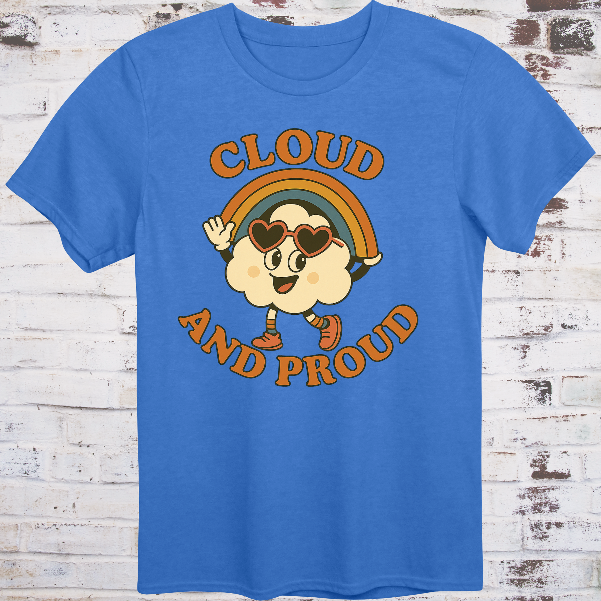 Blue t-shirt with cartoon cloud wearing heart sunglasses  
under a rainbow arch, with bold orange text reading "Cloud and Proud" –  
retro queer pride shirt by Democratee’s