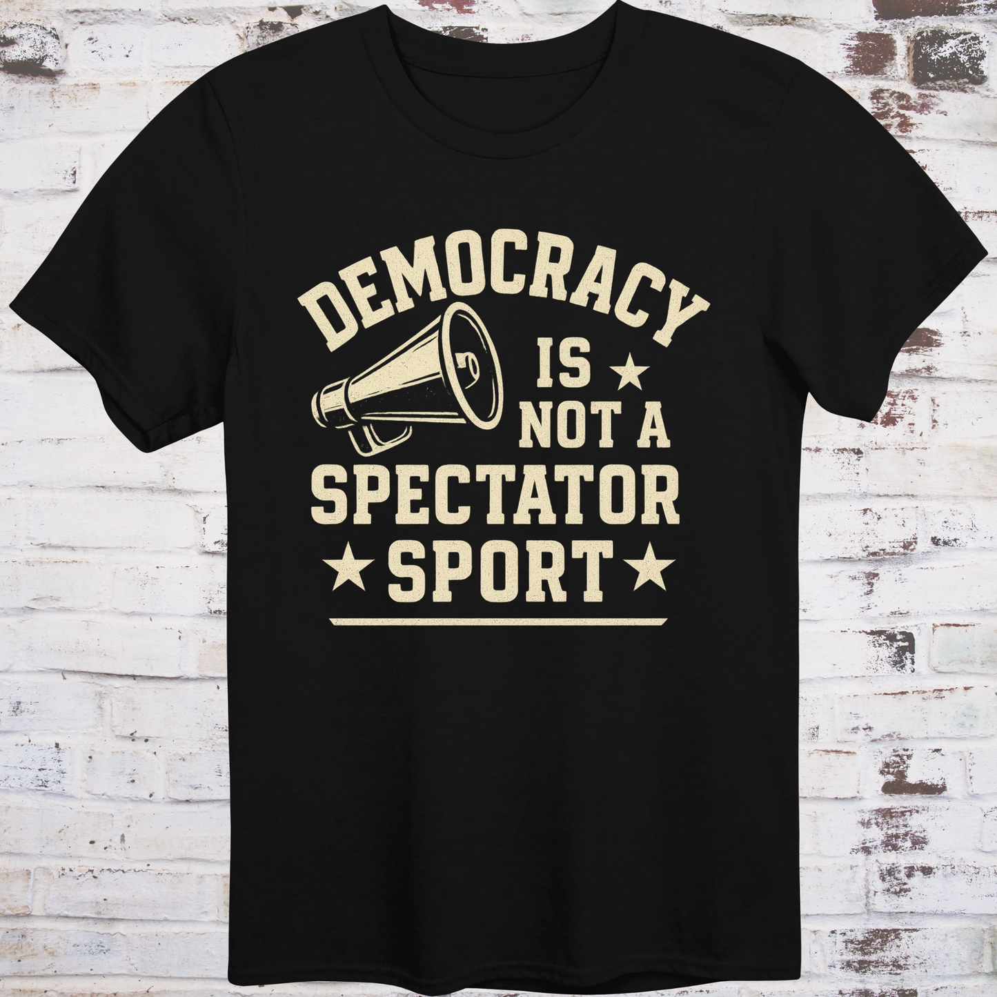 Black t-shirt with vintage megaphone graphic and bold text reading  
"Democracy Is Not a Spectator Sport" – civic action apparel by Democratee’s