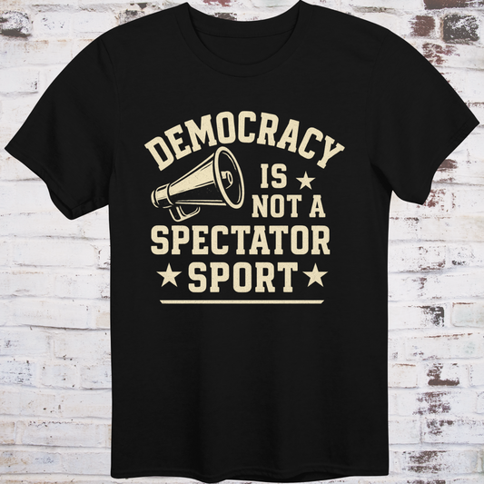 Black t-shirt with vintage megaphone graphic and bold text reading  
"Democracy Is Not a Spectator Sport" – civic action apparel by Democratee’s