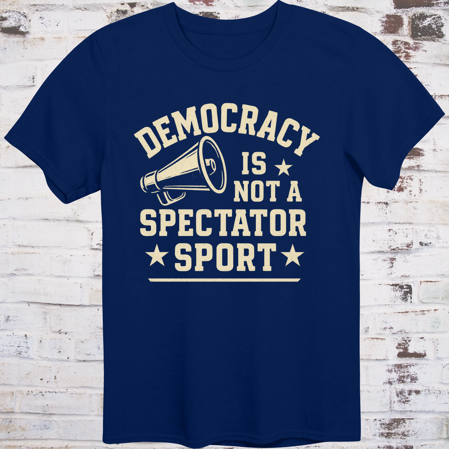 Navy t-shirt with vintage megaphone graphic and bold text reading  
"Democracy Is Not a Spectator Sport" – civic action apparel by Democratee’s