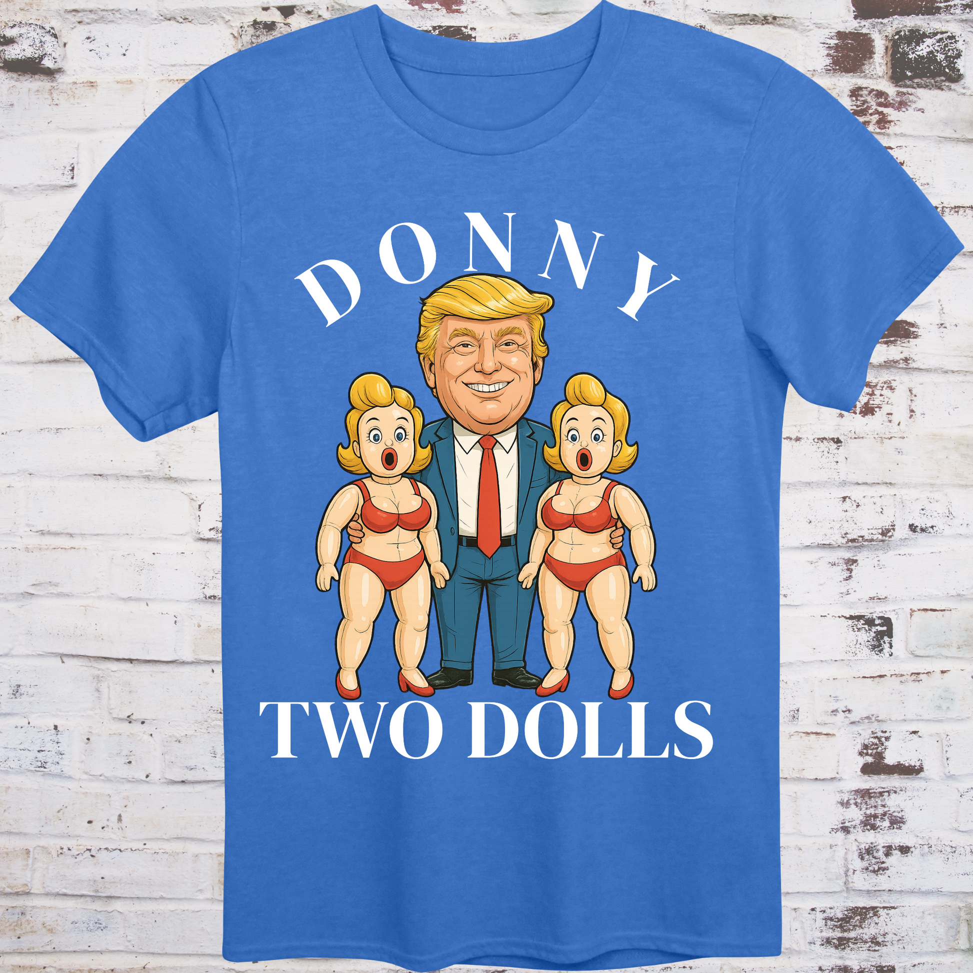 Blue t-shirt with cartoon of Donald Trump standing between  
two exaggerated blow-up dolls in red bikinis,  
with bold text reading "Donny Two Dolls" – parody protest shirt by Democratee’s