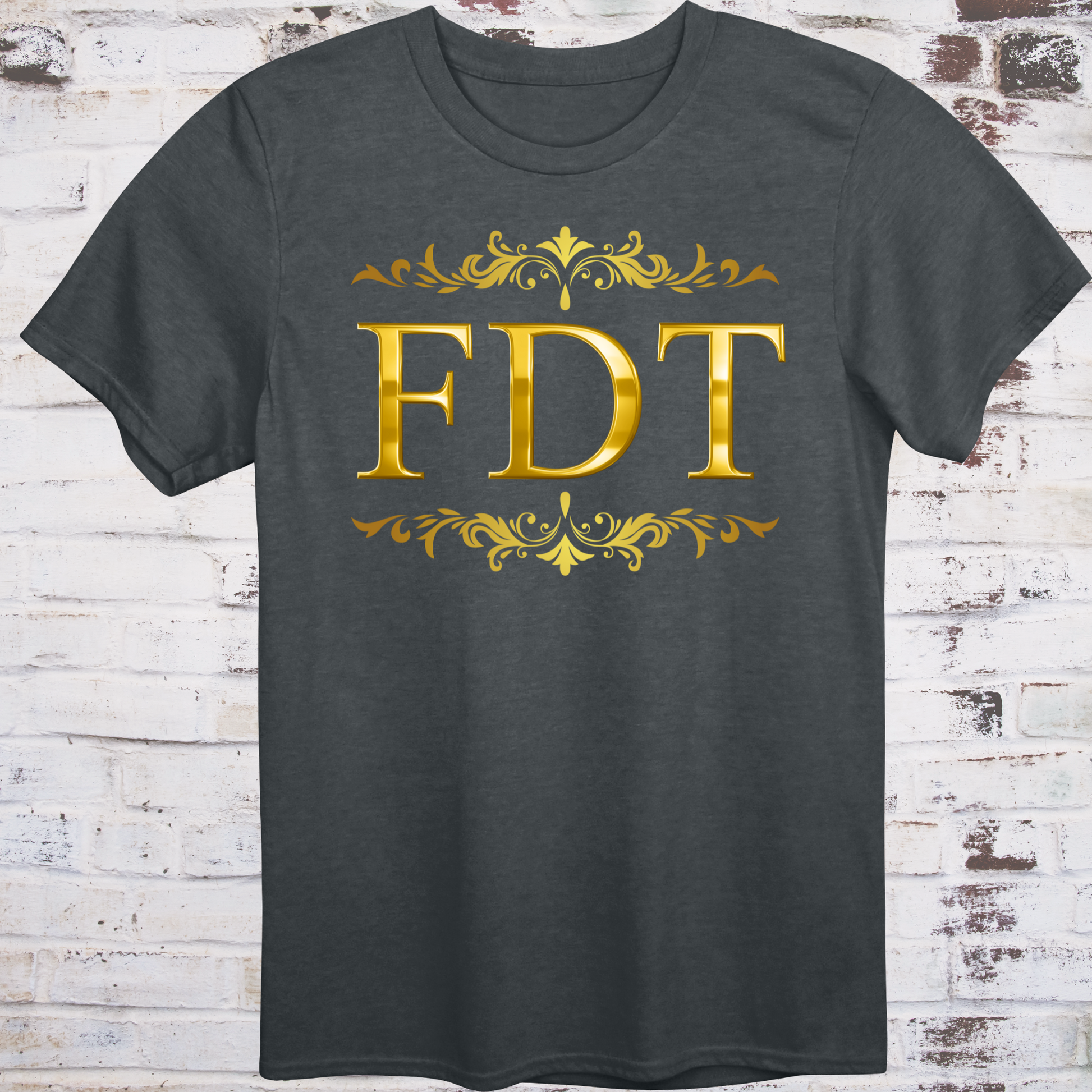 Gray t-shirt with ornate gold design and bold letters “FDT”  
framed in decorative scrollwork – luxury-style protest shirt by Democratee’s