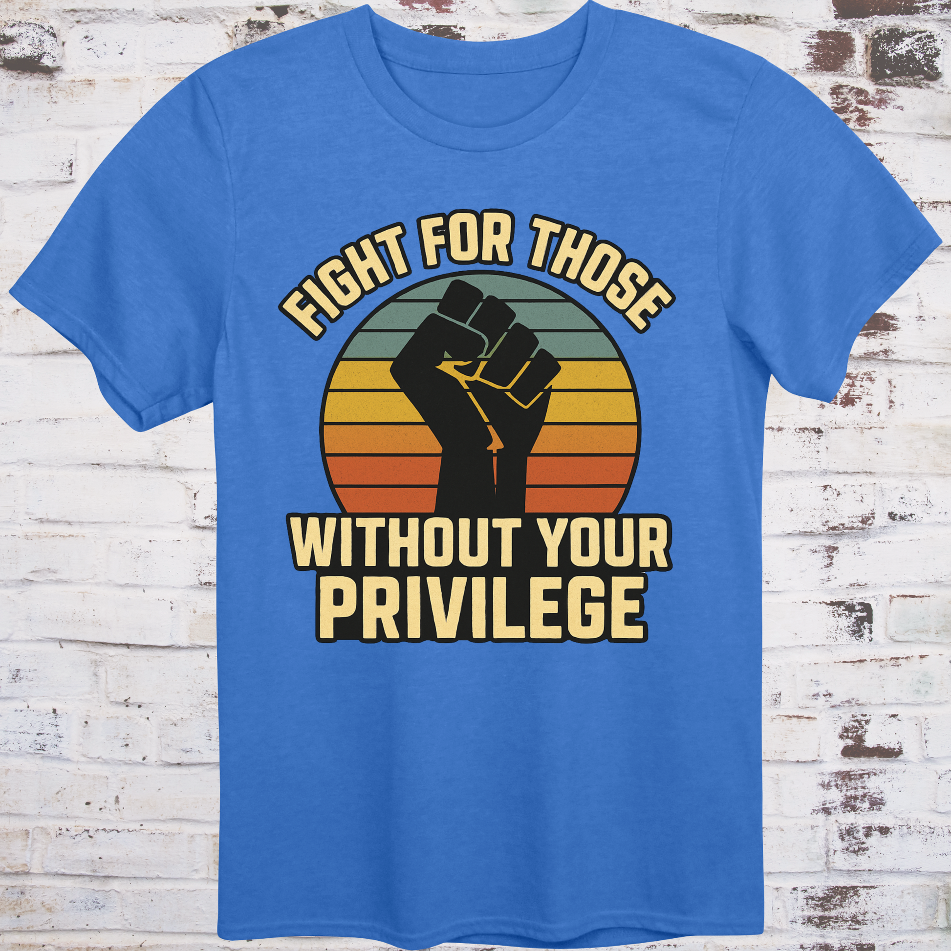 Blue t-shirt with raised fist graphic and vintage sunset background, featuring bold message "Fight for Those Without Your Privilege" – progressive activist apparel by Democratee’s