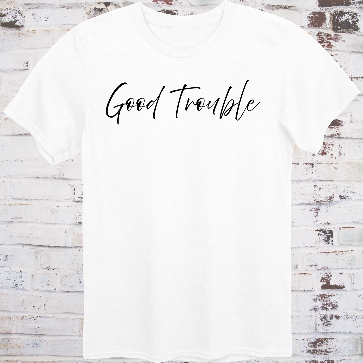 White t-shirt with white handwritten script reading “Good Trouble” –  
minimalist civil rights tribute shirt by Democratee’s