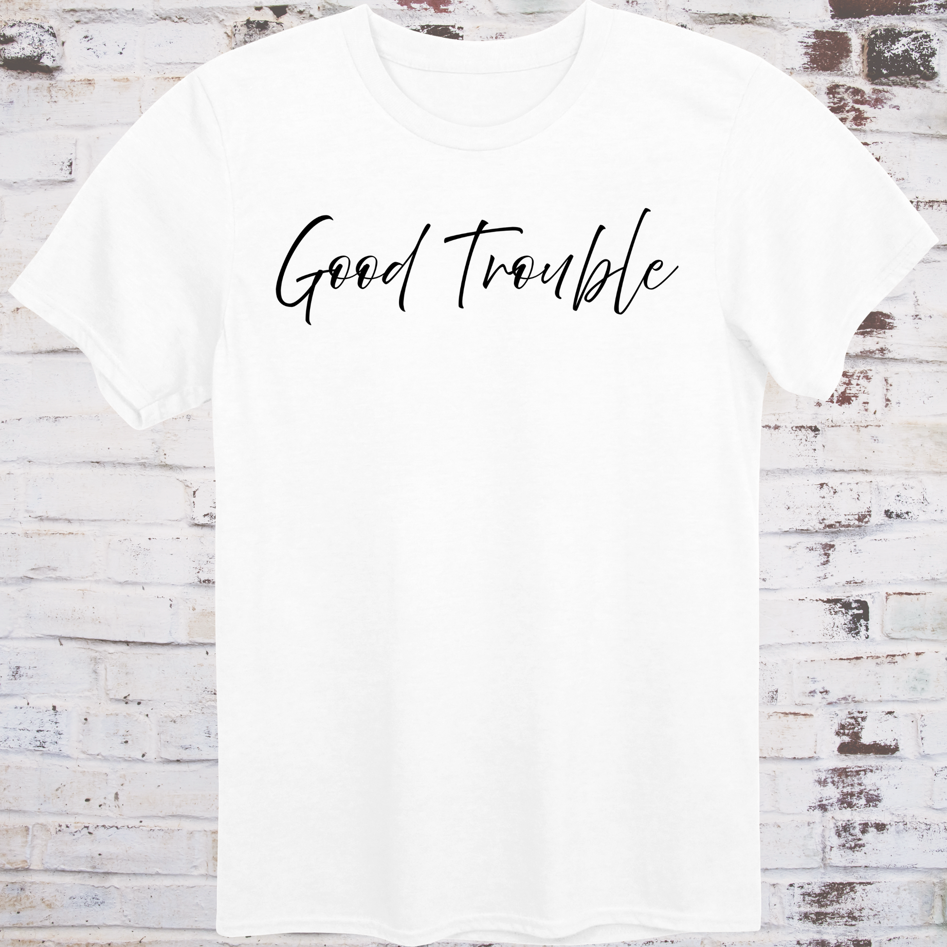 White t-shirt with white handwritten script reading “Good Trouble” –  
minimalist civil rights tribute shirt by Democratee’s