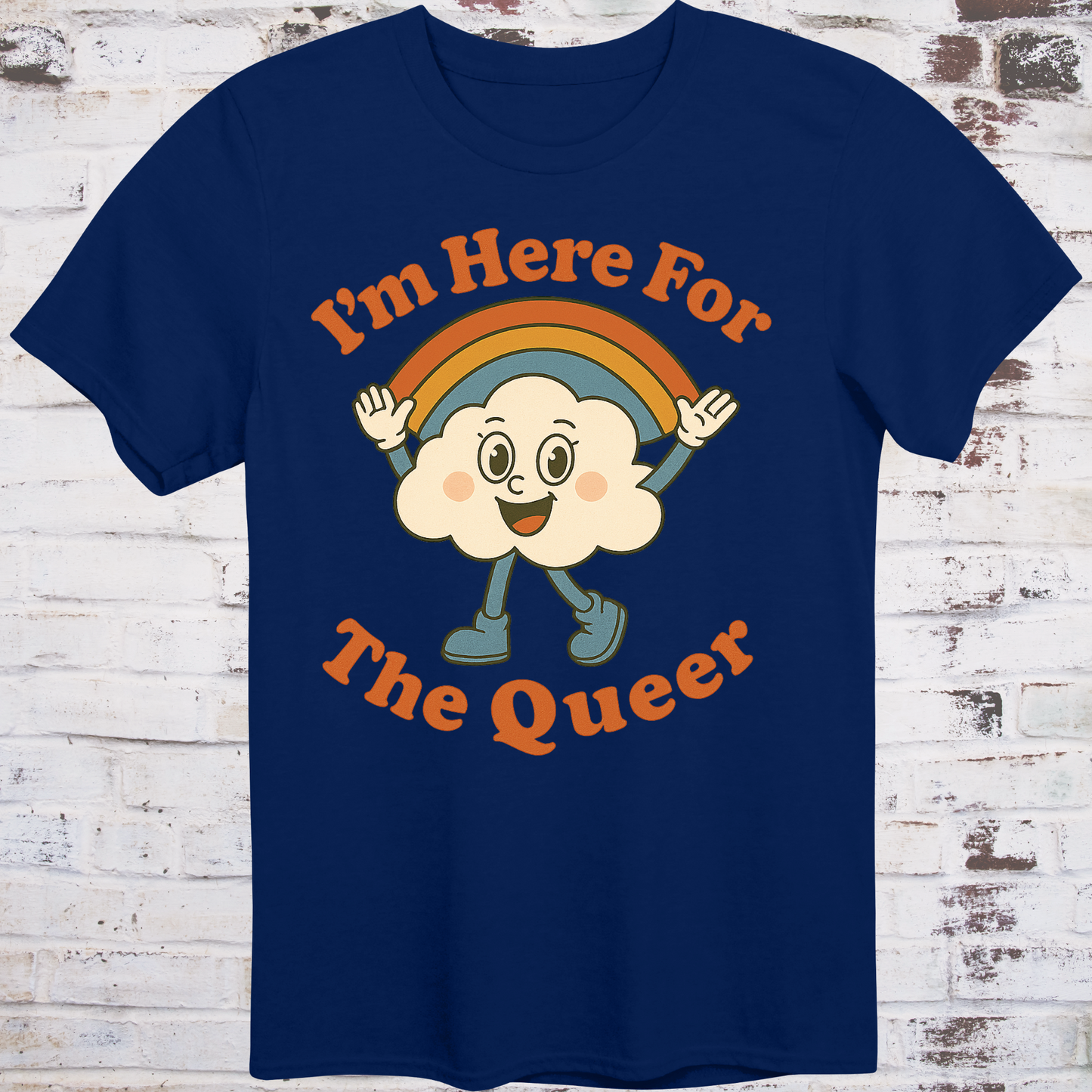 Navy t-shirt with retro-style cartoon cloud wearing boots and a rainbow,  
surrounded by bold text reading "I’m Here for the Queer" –  
inclusive pride shirt by Democratee’s