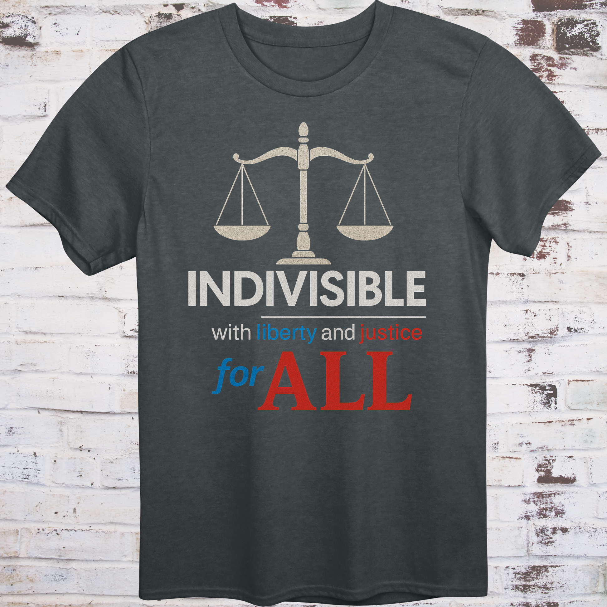Gray t-shirt with balance scale graphic and bold text reading  
"Indivisible with liberty and justice for all" in red, white, and blue –  
progressive political shirt by Democratee’s