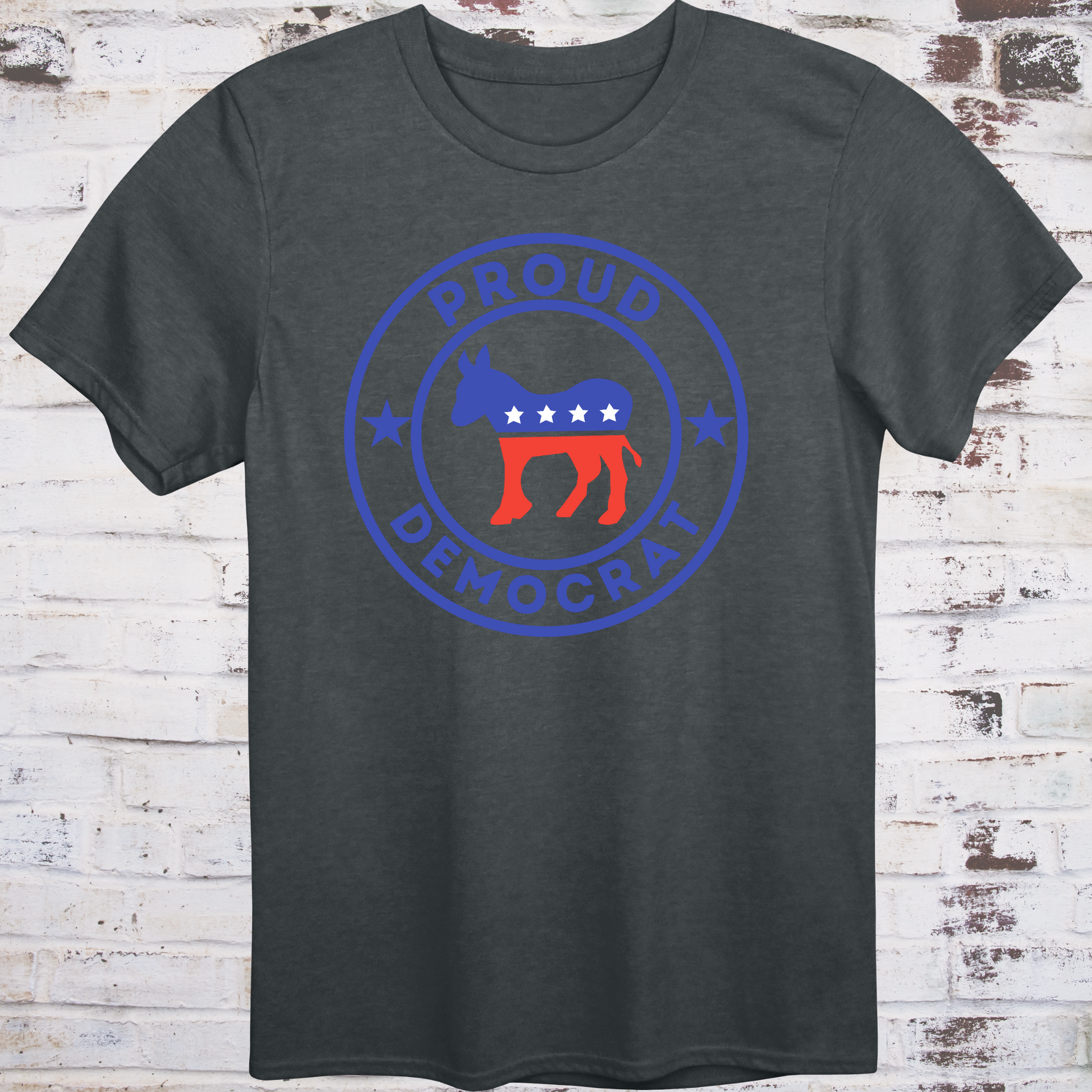 Gray t-shirt with red, white, and blue donkey in a circular badge  
surrounded by stars and bold text reading “Proud Democrat” –  
classic political shirt by Democratee’s