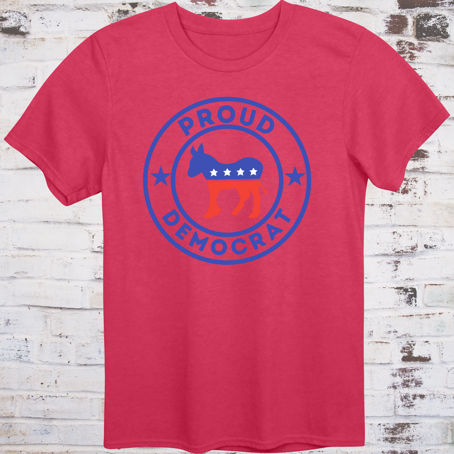 Red t-shirt with red, white, and blue donkey in a circular badge  
surrounded by stars and bold text reading “Proud Democrat” –  
classic political shirt by Democratee’s