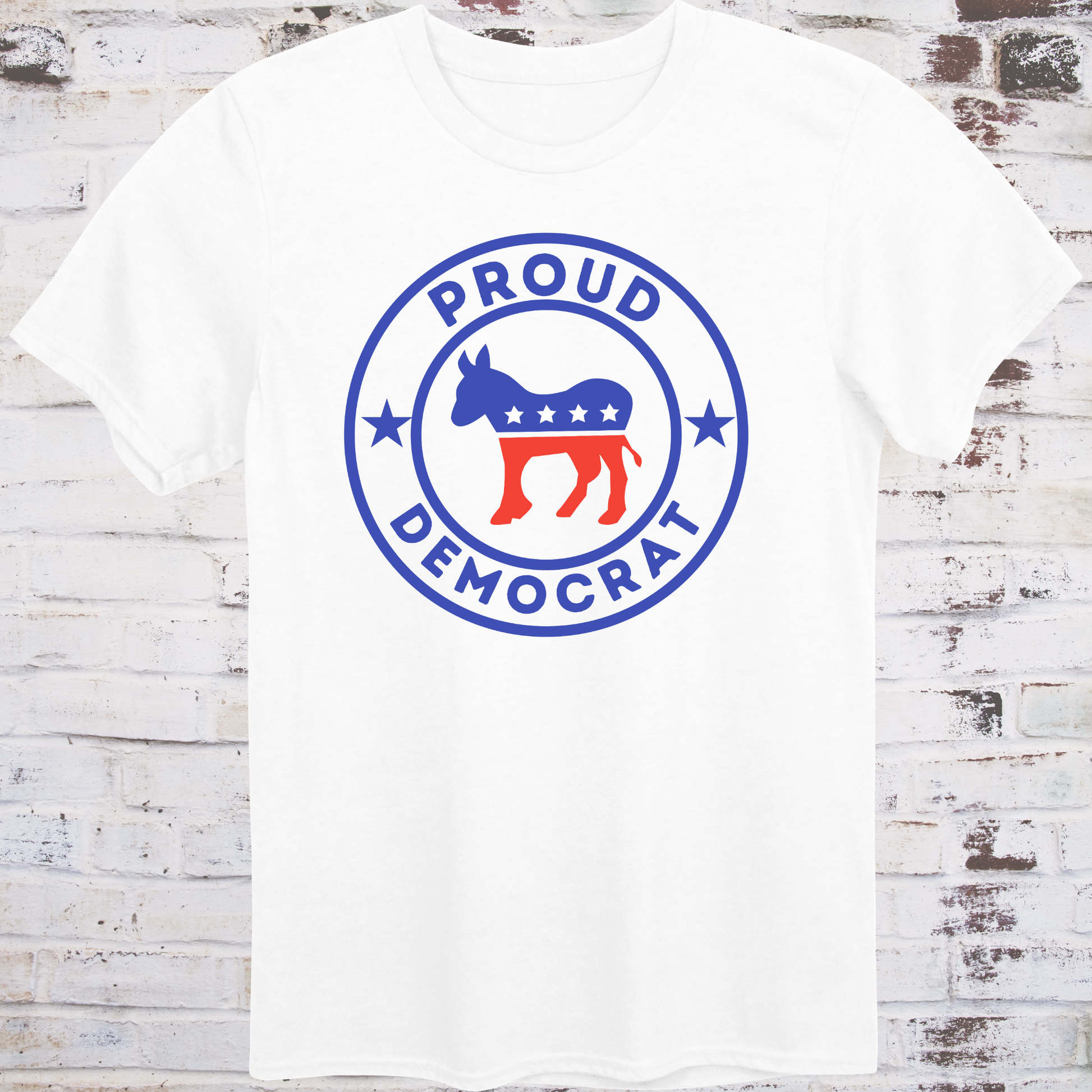 White t-shirt with red, white, and blue donkey in a circular badge  
surrounded by stars and bold text reading “Proud Democrat” –  
classic political shirt by Democratee’s