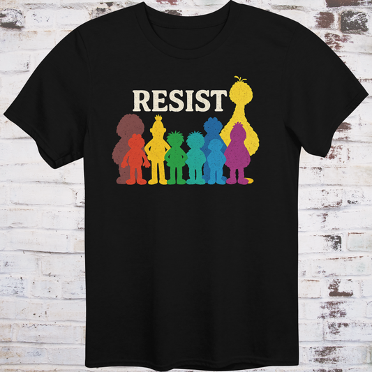 Black t-shirt with bold white RESIST text above rainbow-colored silhouettes  
of classic children’s characters – pride and protest shirt by Democratee’s