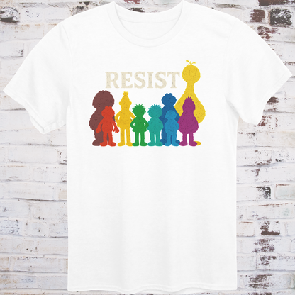 White t-shirt with bold white RESIST text above rainbow-colored silhouettes  
of classic children’s characters – pride and protest shirt by Democratee’s