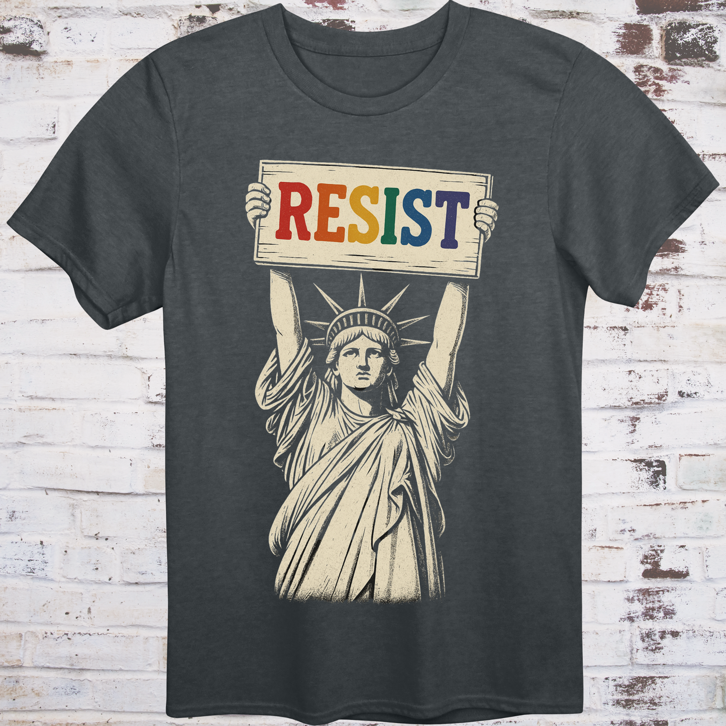 Gray t-shirt featuring vintage illustration of the Statue of Liberty  
holding a rainbow-colored "RESIST" sign –  
progressive pride protest shirt by Democratee’s