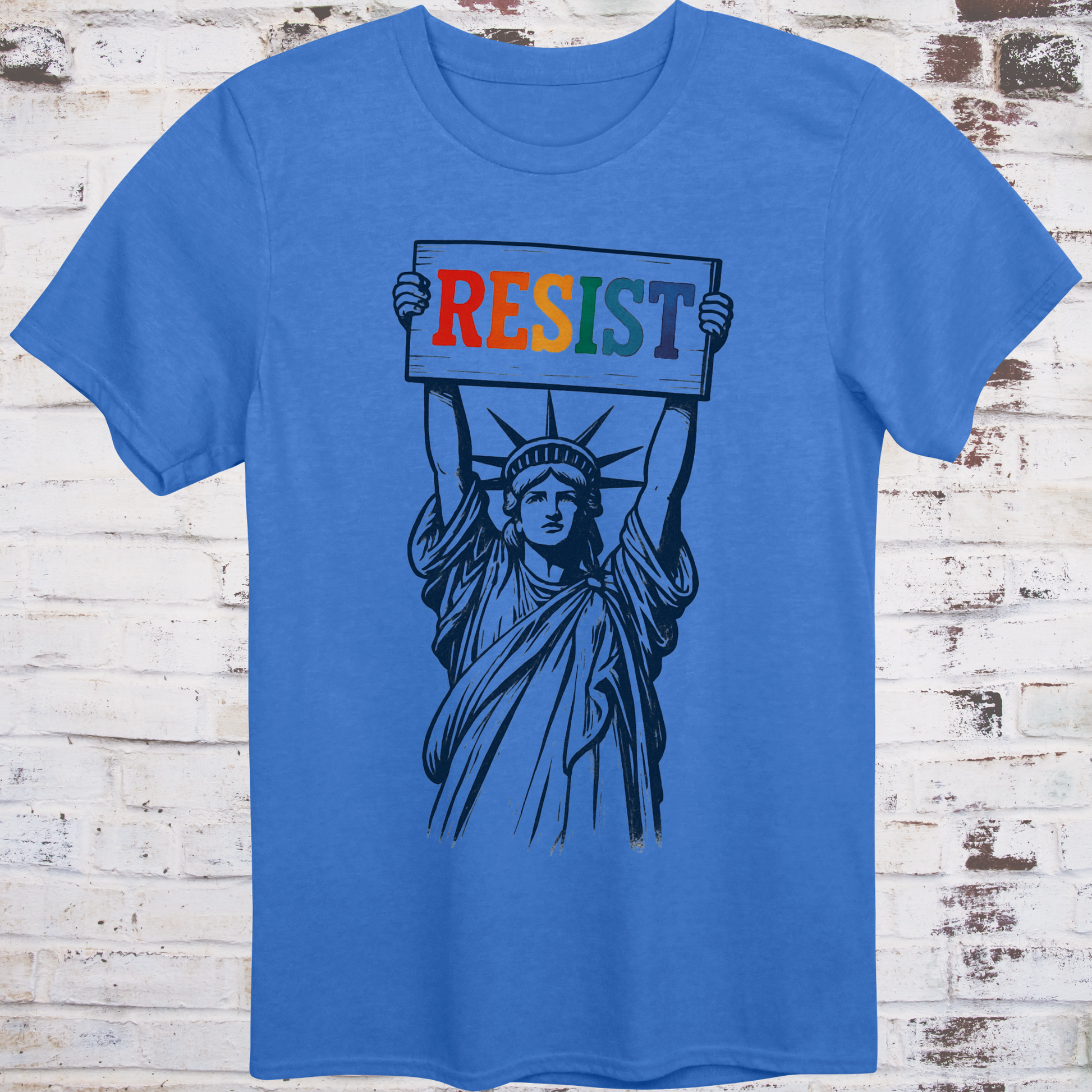 Blue t-shirt featuring vintage illustration of the Statue of Liberty  
holding a rainbow-colored "RESIST" sign –  
progressive pride protest shirt by Democratee’s