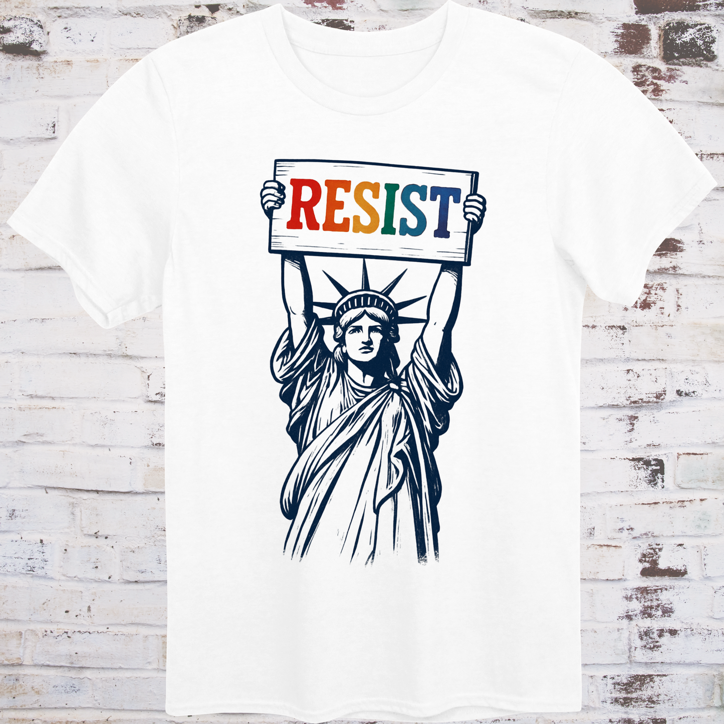 White t-shirt featuring vintage illustration of the Statue of Liberty  
holding a rainbow-colored "RESIST" sign –  
progressive pride protest shirt by Democratee’s