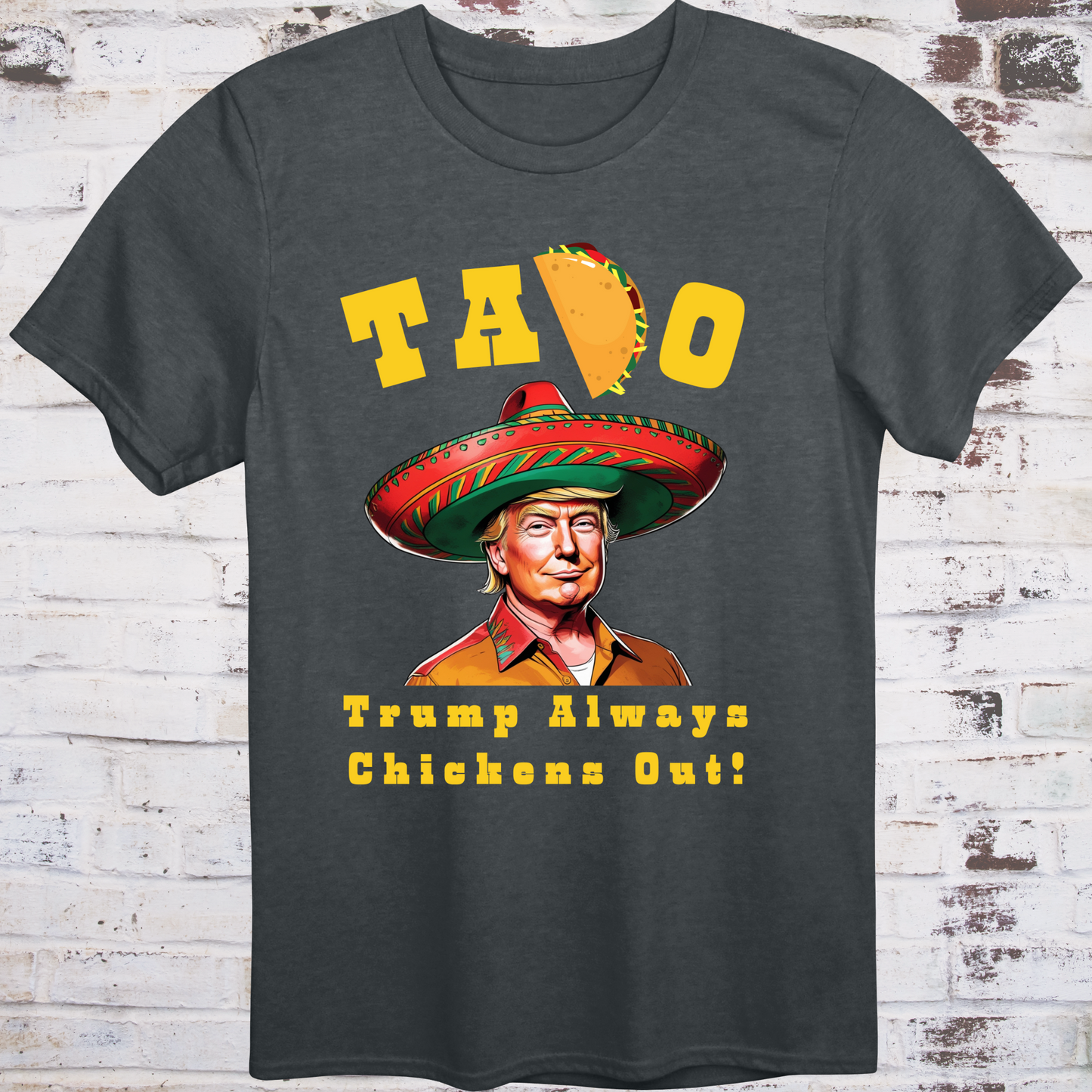 Gray t-shirt with cartoon image of Donald Trump in sombrero  
and yellow text reading “TACO – Trump Always Chickens Out!”  
with a taco replacing the “C” – political parody shirt by Democratee’s