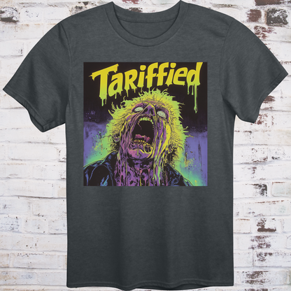 Gray t-shirt featuring a neon horror comic-style illustration  
of a screaming figure melting in slime with text “Tariffied” –  
anti-Trump parody shirt by Democratee’s