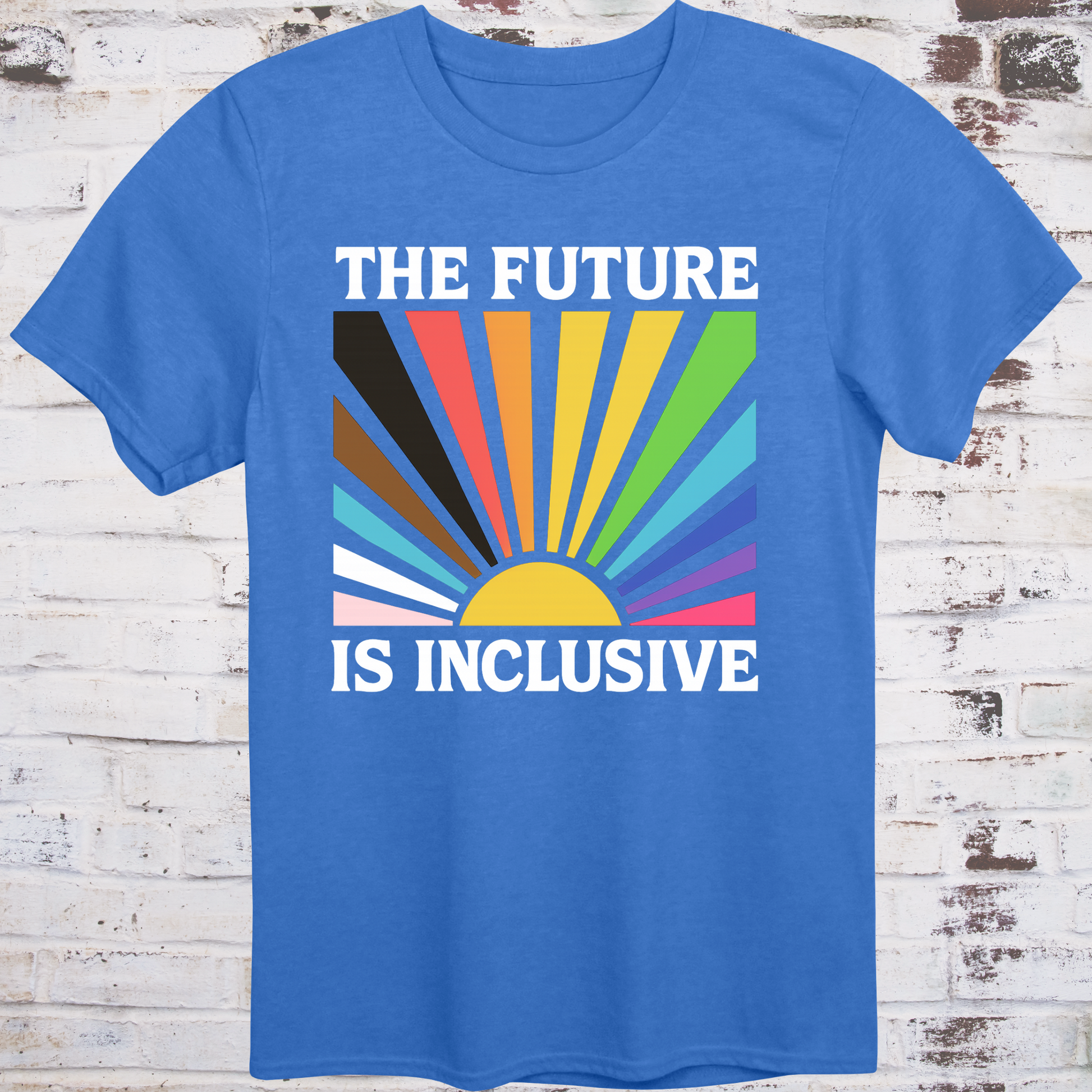 Blue t-shirt with retro-style sunburst in progress pride flag colors  
and bold white text reading "The Future Is Inclusive" –  
intersectional activist shirt by Democratee’s