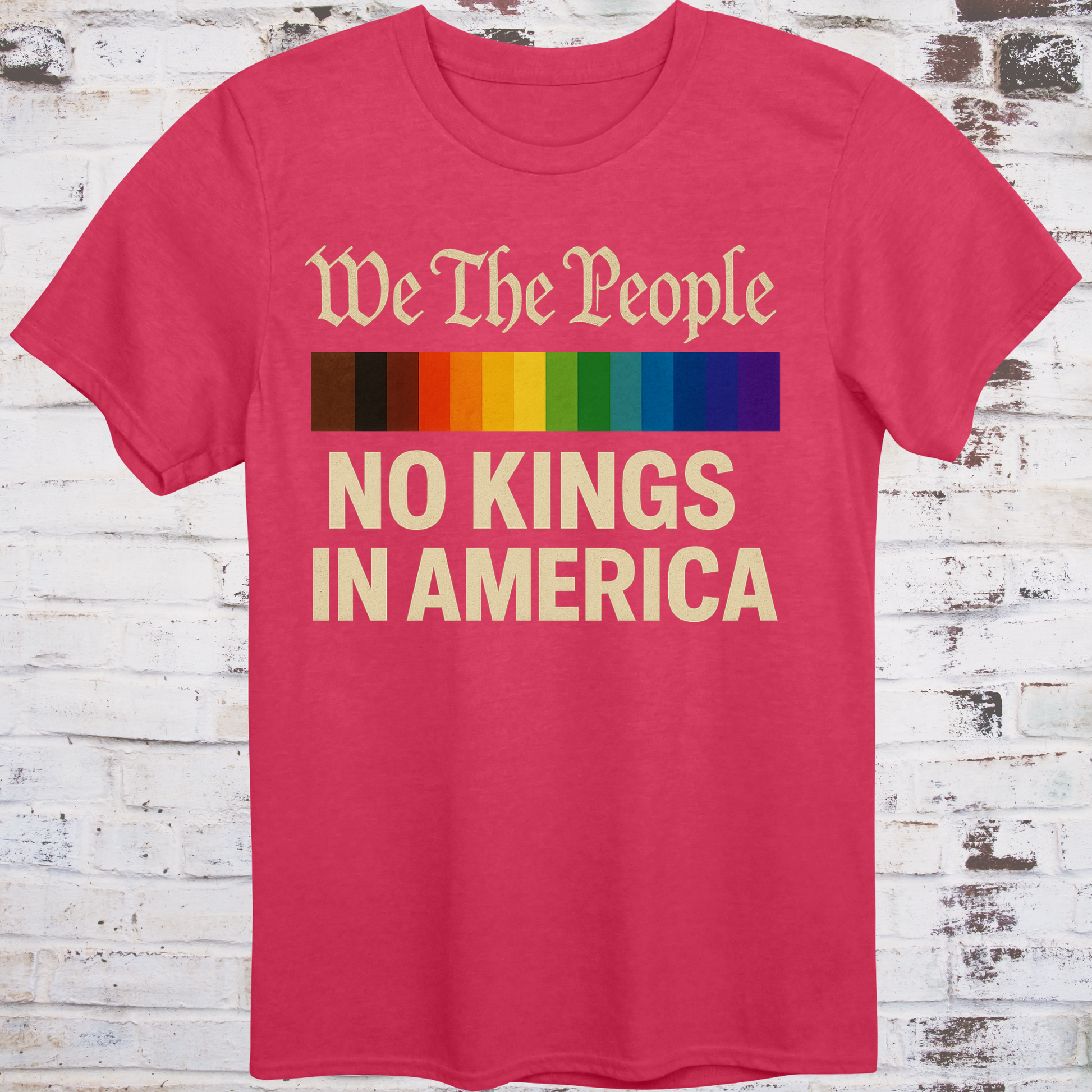 Red t-shirt with the phrase 'We The People' in old script above a Progress Pride flag, and bold text below reading 'No Kings in America' — a pro-democracy, LGBTQ+ inclusive design."