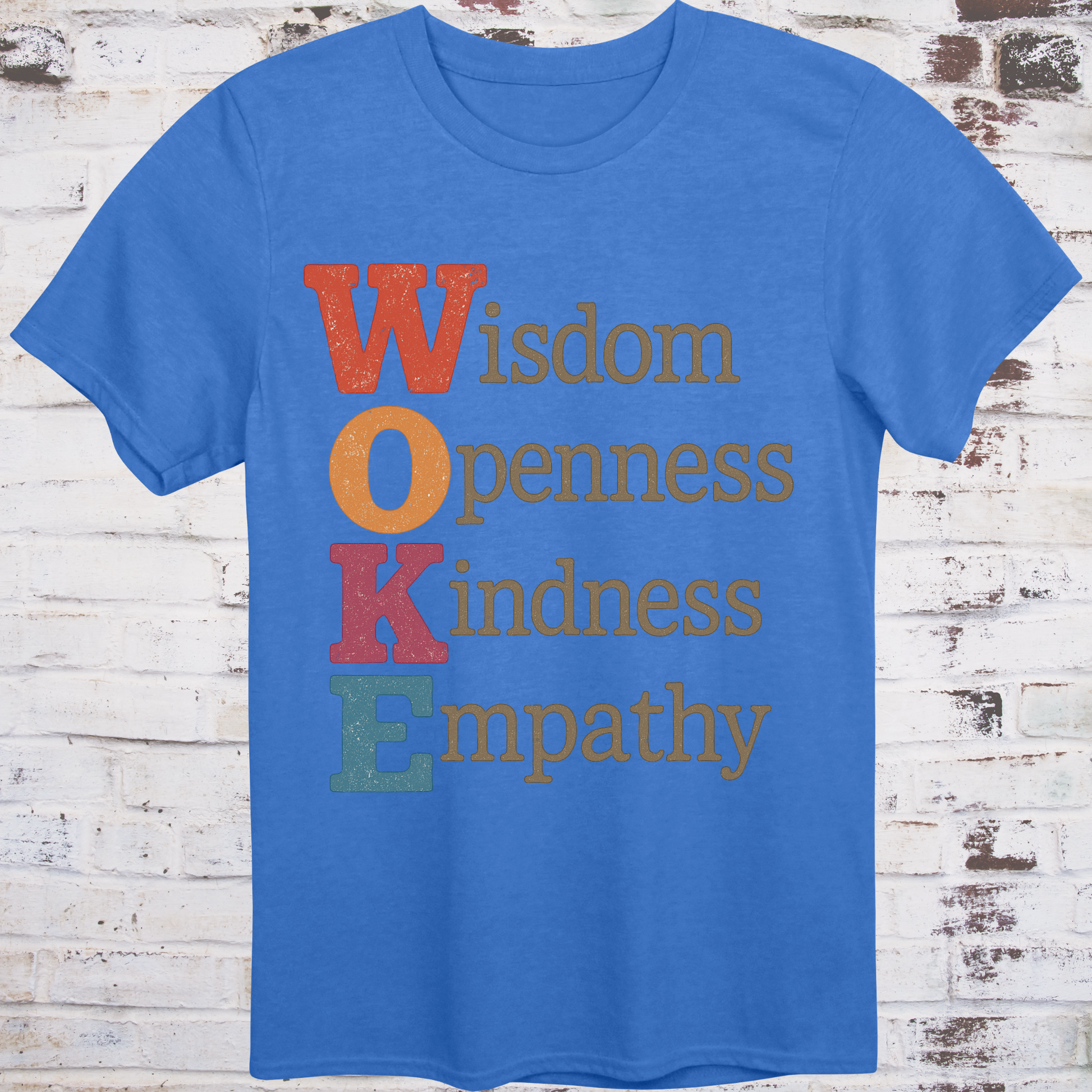 Blue t-shirt with bold vertical WOKE acronym in colorful letters,  
spelling out Wisdom, Openness, Kindness, and Empathy –  
reclaimed progressive shirt by Democratee’s