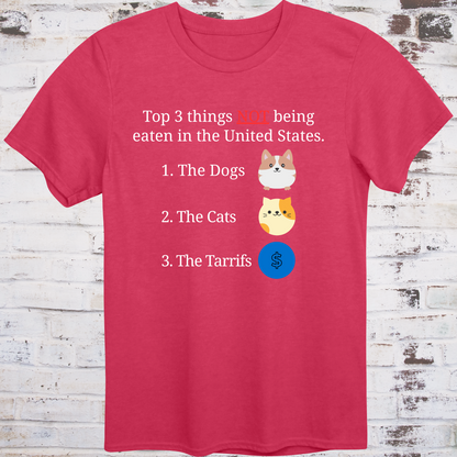 Red t-shirt with cartoon icons of a dog, a cat, and a dollar sign  
next to text listing “Top 3 Things NOT Being Eaten in the United States” –  
funny political parody shirt by Democratee’s