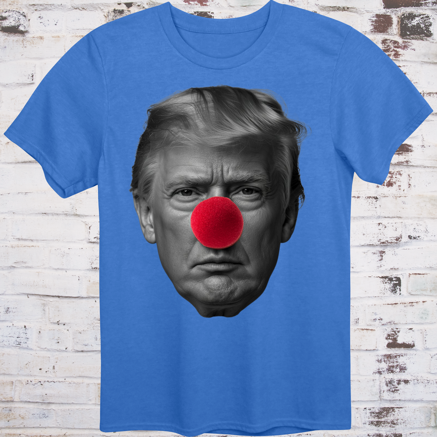 Blue t-shirt featuring a high-contrast black-and-white photo  
of Donald Trump’s face with a large red clown nose –  
minimalist parody protest shirt by Democratee’s