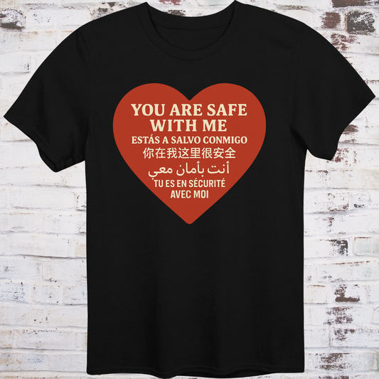 Black T-shirt with heart graphic reading “You Are Safe With Me” in six languages including English, Spanish, Chinese, Arabic, and French