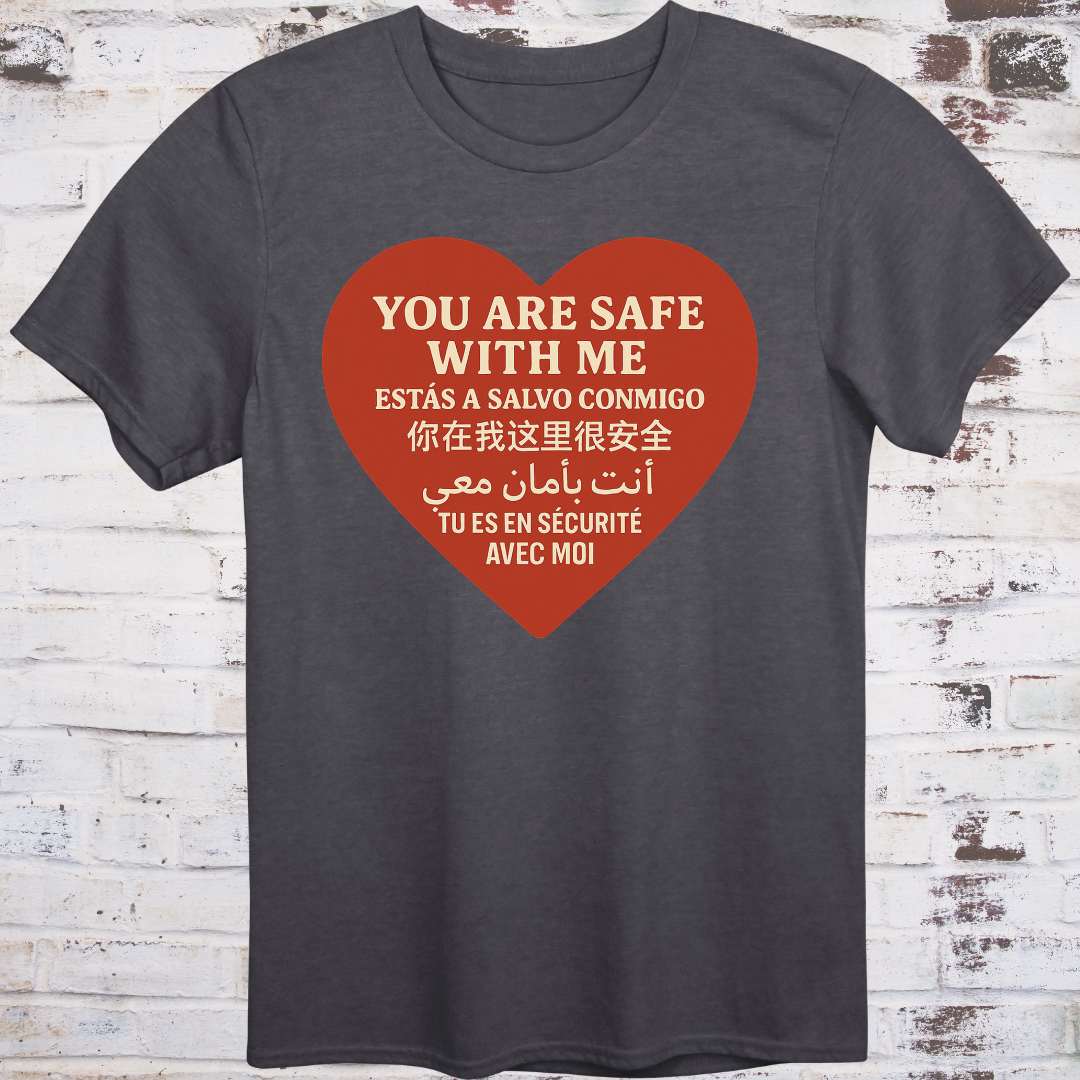 Gray T-shirt with heart graphic reading “You Are Safe With Me” in six languages including English, Spanish, Chinese, Arabic, and French