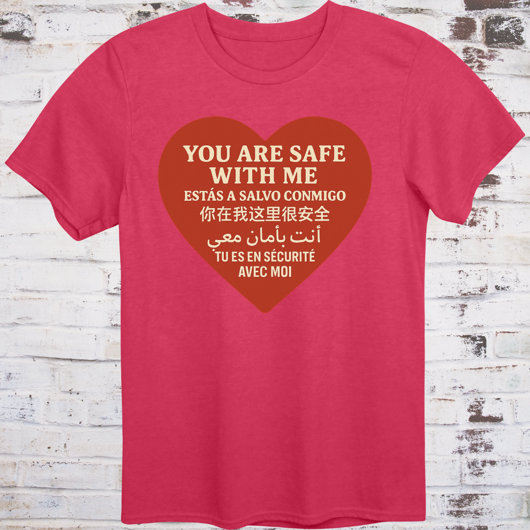 Red T-shirt with heart graphic reading “You Are Safe With Me” in six languages including English, Spanish, Chinese, Arabic, and French
