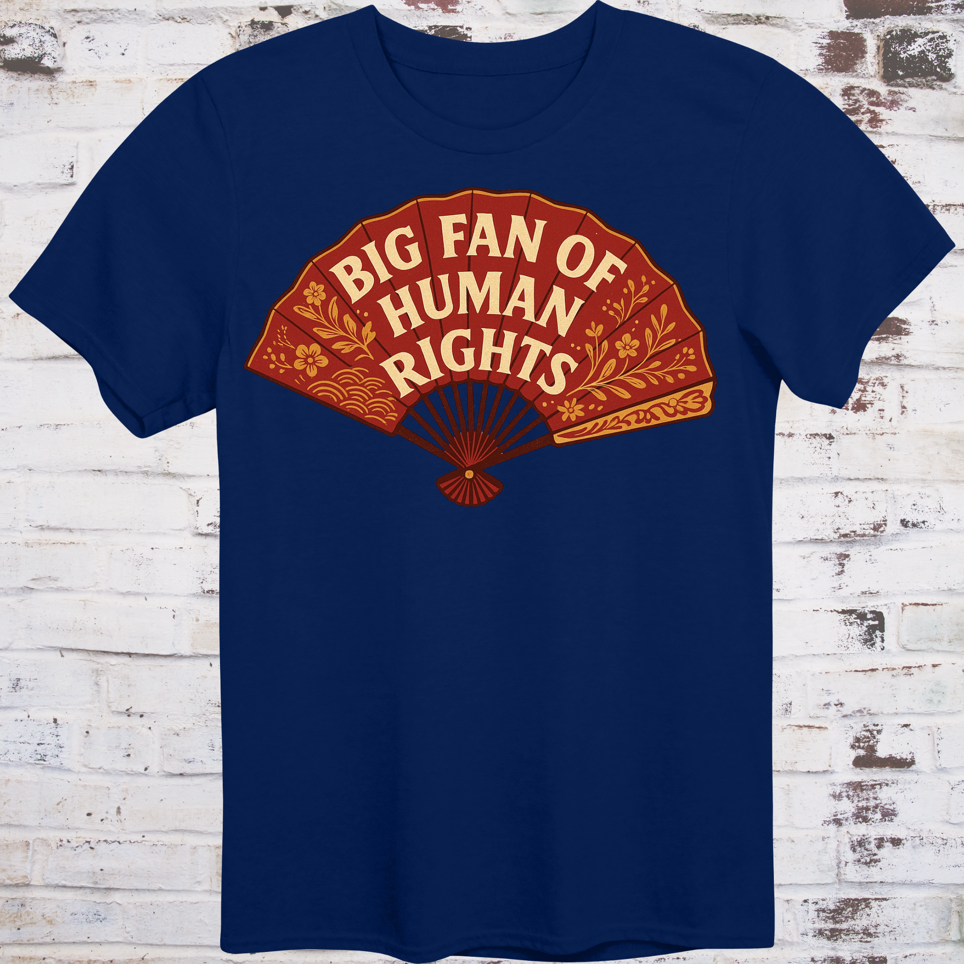 Navy blue t-shirt with a red fan graphic and text 'Big Fan of Human Rights' on a wooden background