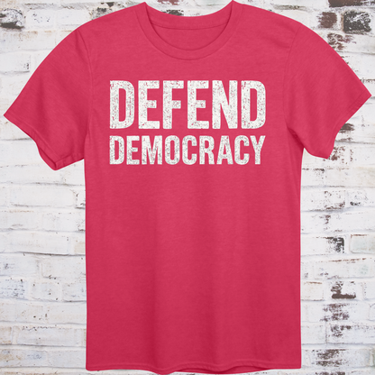 Red t-shirt with 'DEFEND DEMOCRACY' text on a wooden background