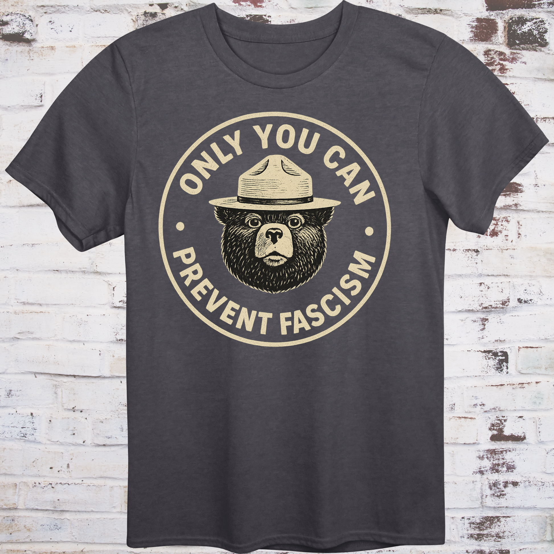Vintage-style design of a serious bear in a ranger hat with text "Only You Can Prevent Fascism"
