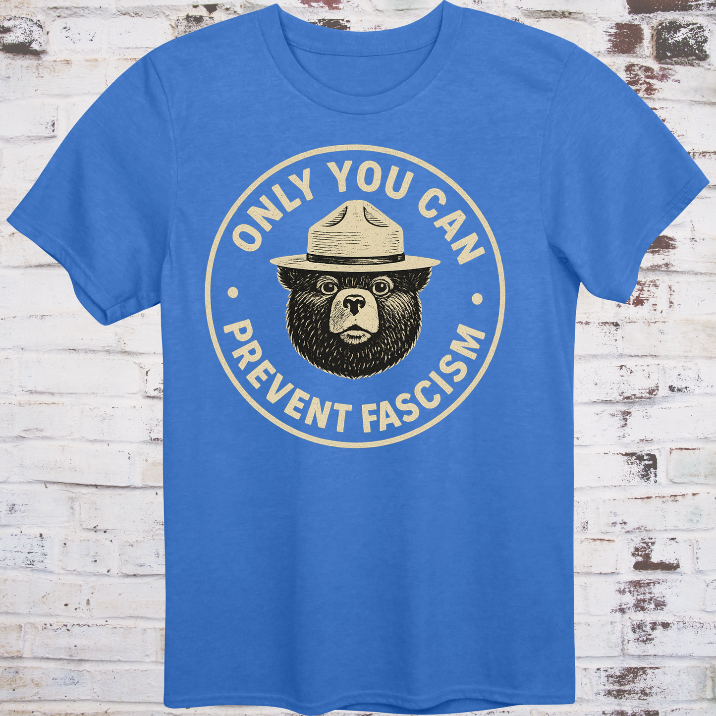 Vintage-style design of a serious bear in a ranger hat with text "Only You Can Prevent Fascism"