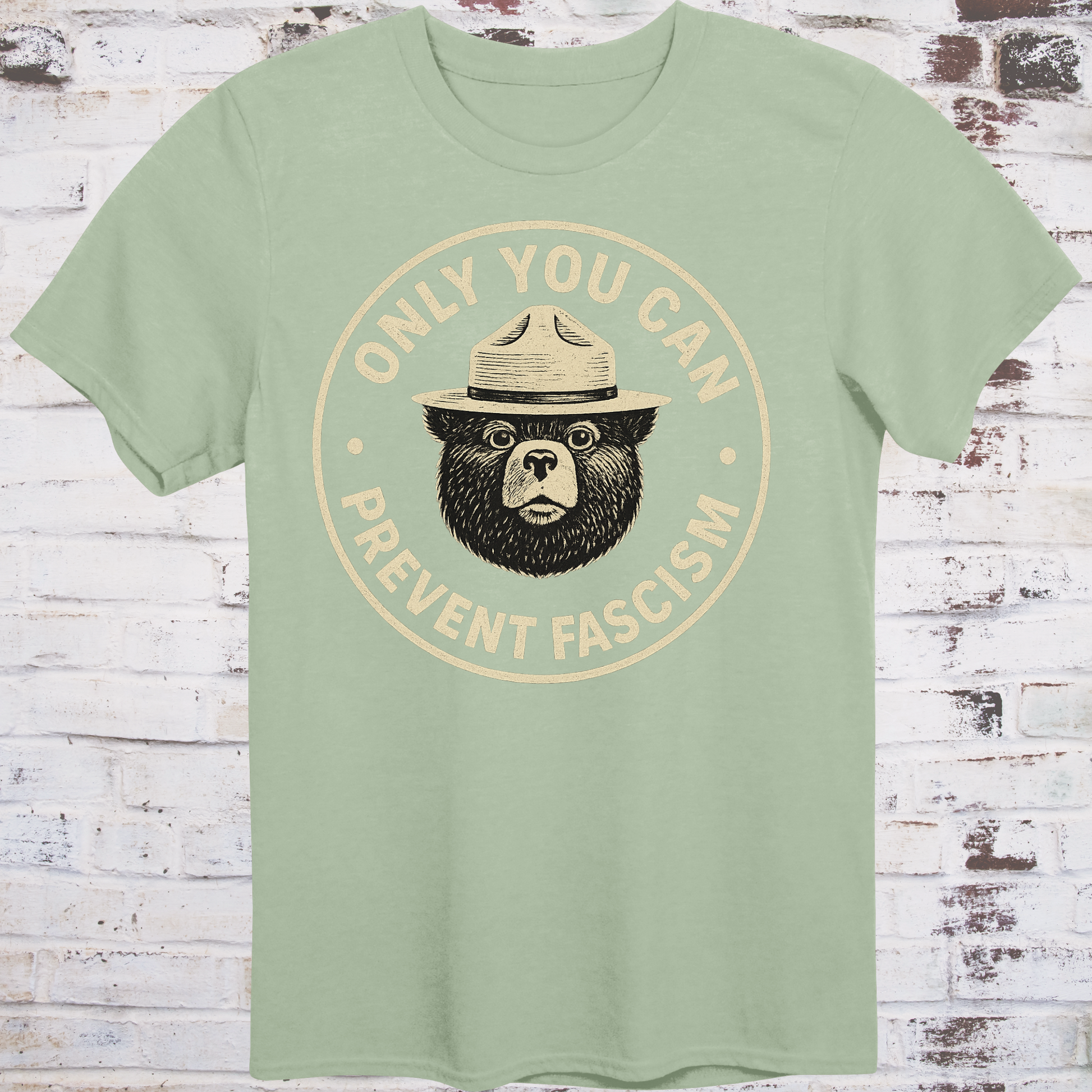 Vintage-style design of a serious bear in a ranger hat with text "Only You Can Prevent Fascism"