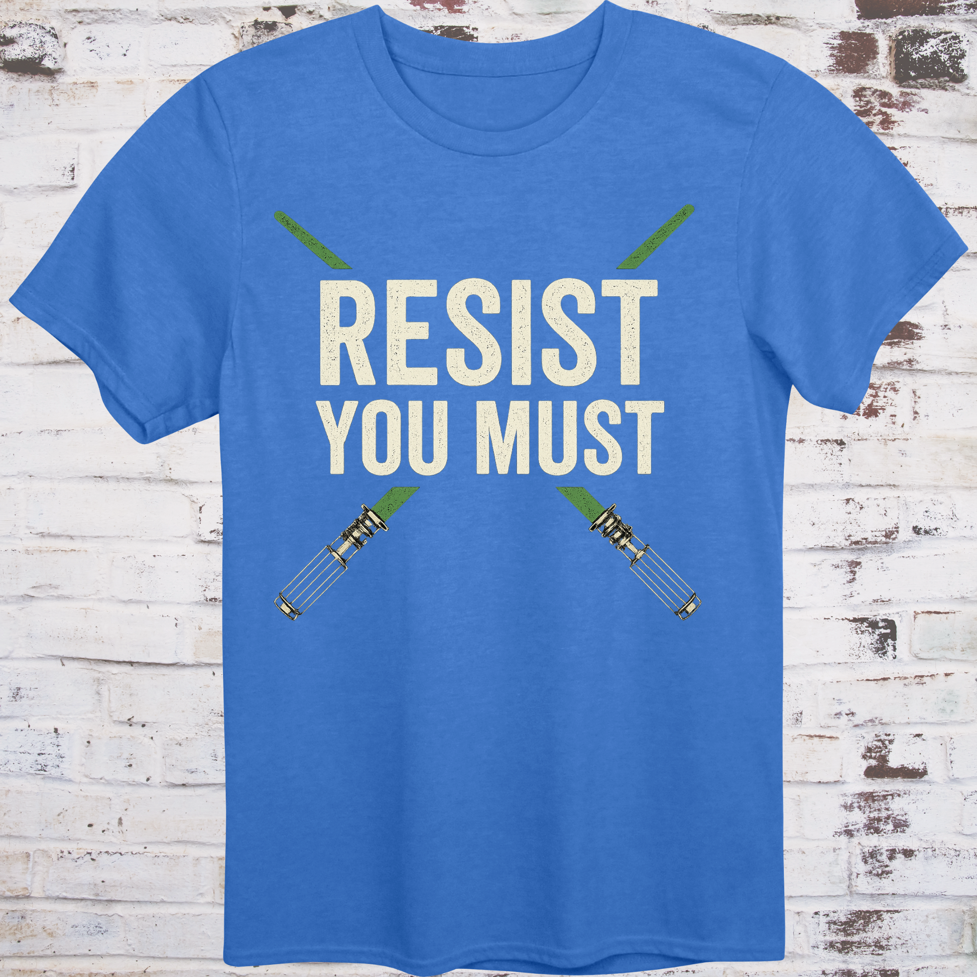 Sci-fi protest tee with green lightsabers and bold block text: “Resist You Must”