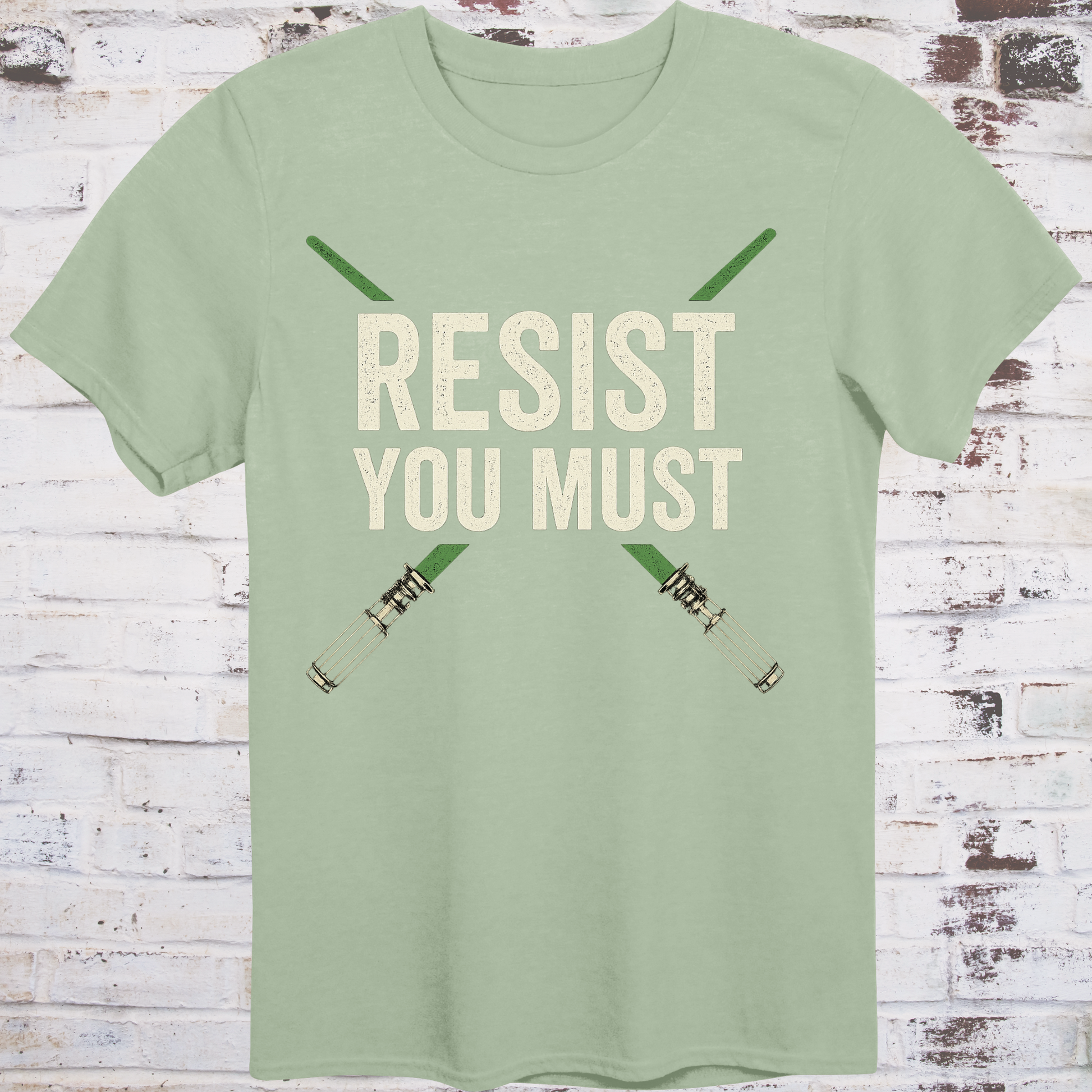 Sci-fi protest tee with green lightsabers and bold block text: “Resist You Must”