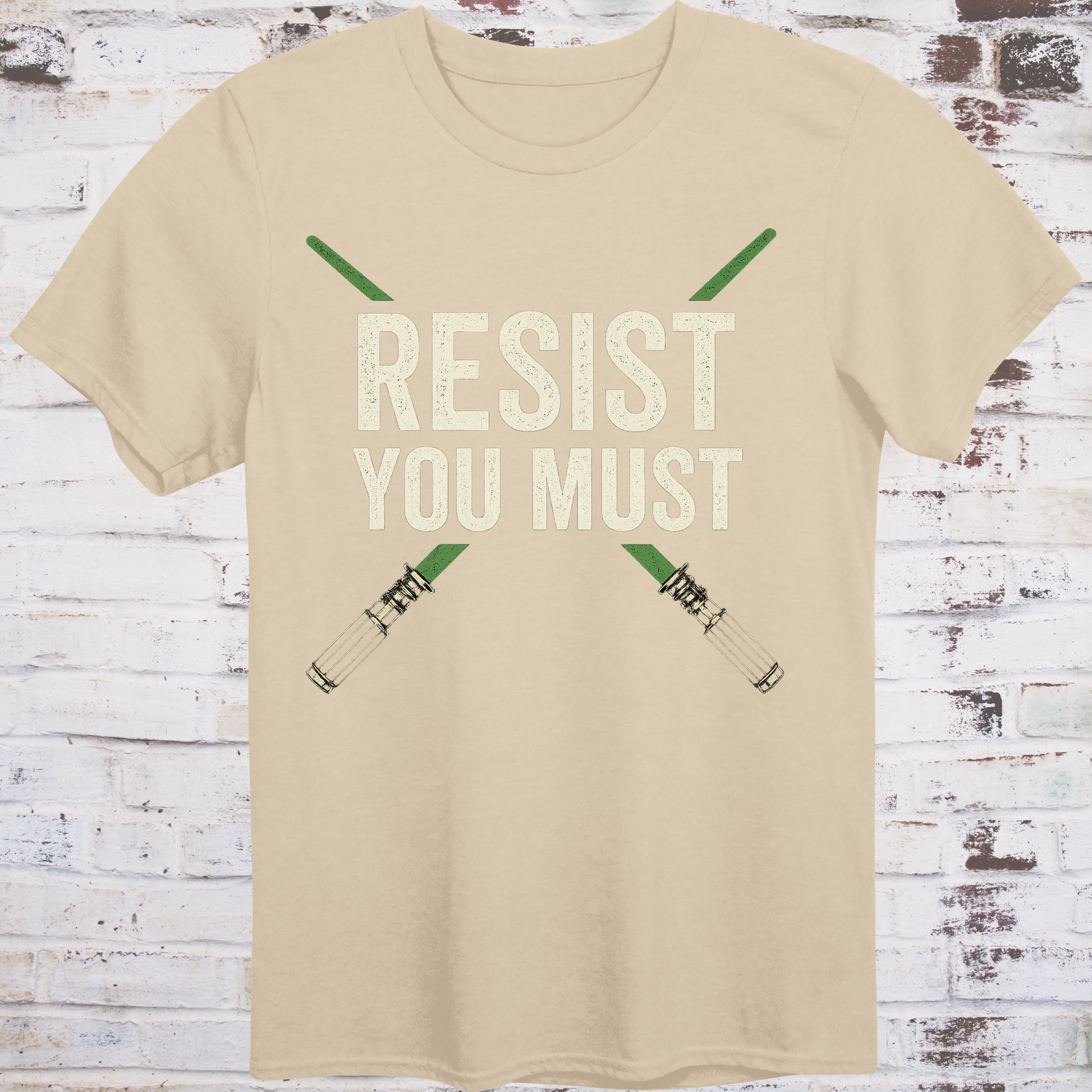Sci-fi protest tee with green lightsabers and bold block text: “Resist You Must”
