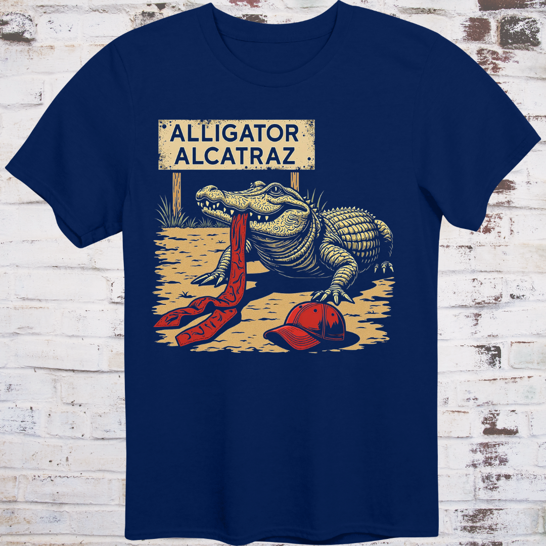 Navy blue t-shirt with alligator graphic and 'Alligator Alcatraz' sign on a wooden background